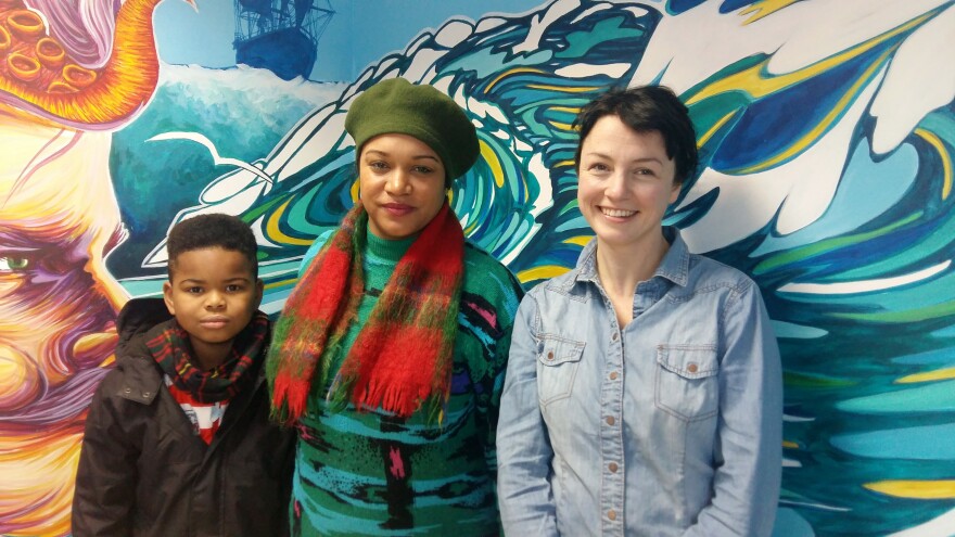 Katie Finnegan-Clarke (right) and Cleo Lake (center), standing with Lake's son, help run Countering Colston, an activist group lobbying for Edward Colston's name to be removed from city streets, schools and landmarks.