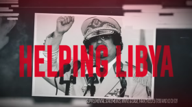 An ad against Pureval being run by the Congressional Leadership Fund flashes images of Muammar Qaddafi and the wreckage of a crashed airliner. 