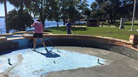 Douglas Van Horn and his wife Victoria work on renovating one of the Riverfront Fountains basins. Photo courtesy of Alex Sharp.