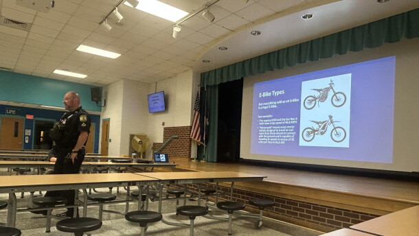 Virginia Beach Police MPO Tony Espinosa talks with families about e-bike safety at Cooke Elementary on Sept. 26, 2026.