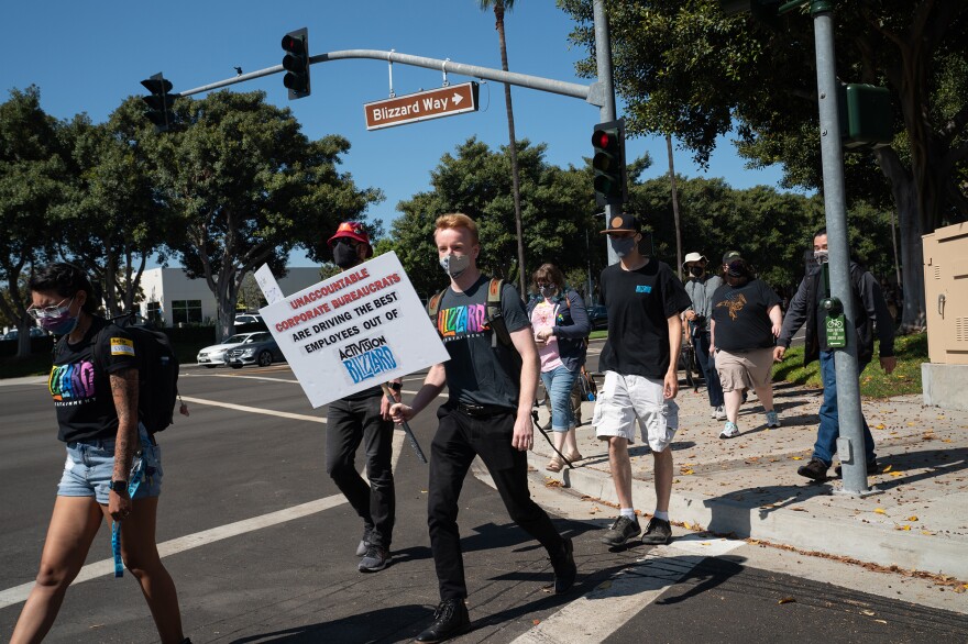 Employees walk across Blizzard Way during a walkout at Activision Blizzard offices in Irvine, Calif., on Wednesday.
