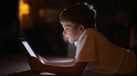 A 10-year-old boy uses an Apple iPad. (Christopher Furlong/Getty Images)