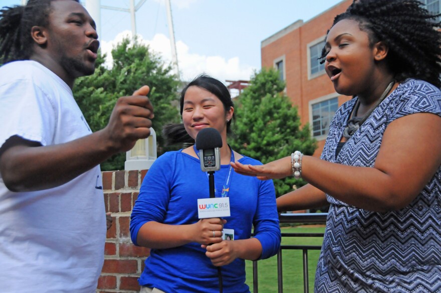 An image of youth reporters dancing