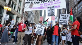 Abortion rights and Palestinian supporters march down Michigan Avenue during the first major protest ahead of the Democratic National Convention on Sunday evening. The convention opens Monday.