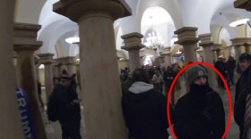 Screenshot of video footage showing Huttle (red circle) roaming through the Crypt of the U.S. Capitol in Washington, D.C.