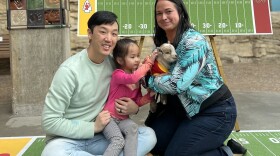 Democratic Rep. Rui Xu and his family hold a goat at a Kansas City Chiefs event prior to the Super Bowl. Left to right: Xu, daughter Astra, and wife Kearsha.