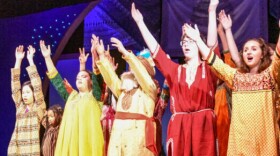 Students in ArtsBuild’s Imagine! Program on stage.