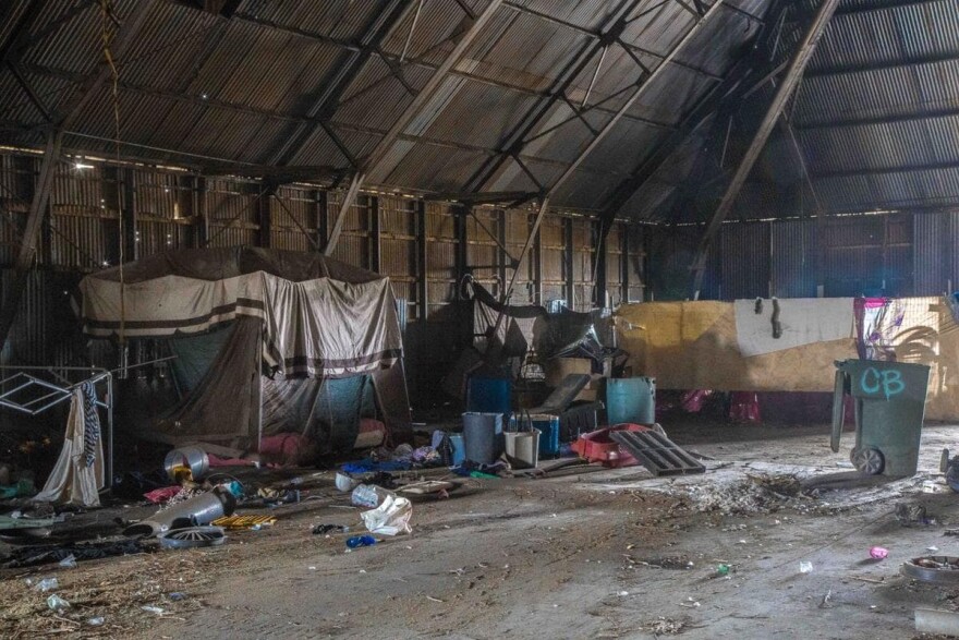 An abandoned factory warehouse serves as shelter for some homeless people in Bakersfield, California. (Photo by Michael K. Chadburn)