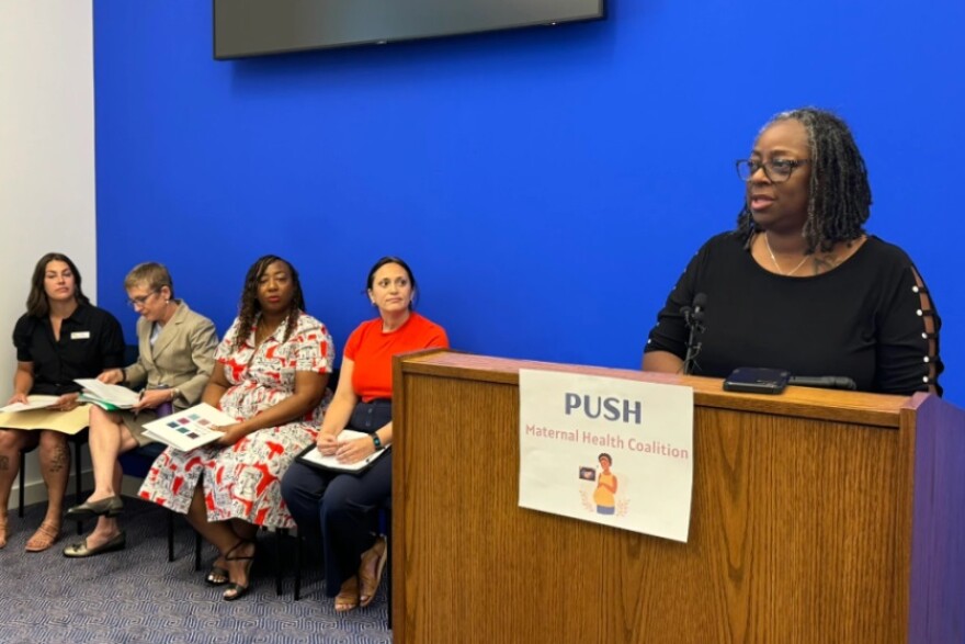 Nichole Wardlaw, a midwife with the American College of Nurse-Midwives, speaks at a press event at the capital.