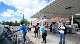School meals have been done by drive-through since mid-March; officials hope to return to in-person classes in August.