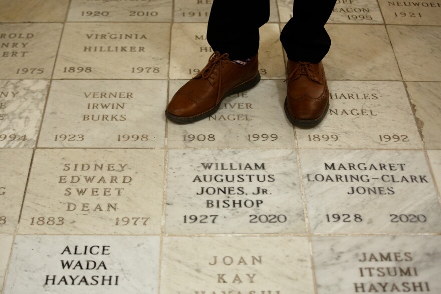 Bishop Deon Johnson stands next to the burial site of the former bishop of the Episcopal Diocese of Missouri at Christ Church Cathedral in St. Louis' Downtown West neighborhood.