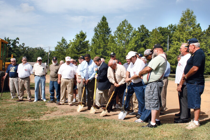 Officials from the city, county, and VFW break ground for the veterans memorial.