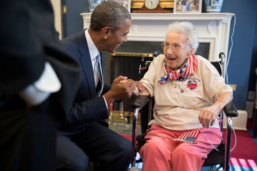 President Obama and Vice President Biden visit with Lucy Coffey in the Vice President's Office of the White House on July 25, 2014.