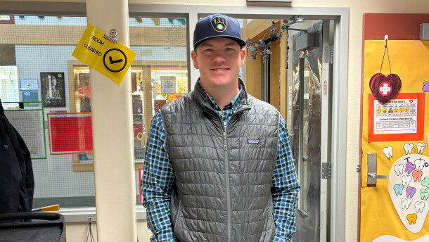 Eagle’s View Elementary School Principal Riley Spetz, a lifelong Milwaukee Brewers fan, wears a Brewers cap.