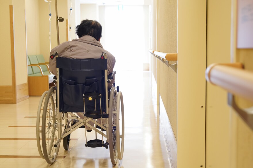  Elderly female in wheel chair.