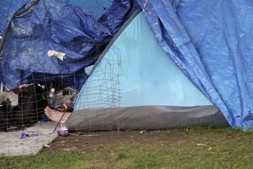 A resident of Loomis Street rests in his tent.
