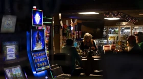 Slot machines light up the front window of a bar in Golconda, Illinois.