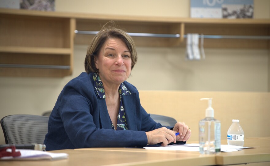 Sen. Amy Klobuchar listens to hospital administration July 25, 2025, while visiting Grand Itasca Hospital & Clinic in Grand Rapids.