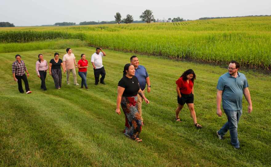 Attendees of a recent U of M Extension leadership education session participate in a walking meeting in Glencoe.