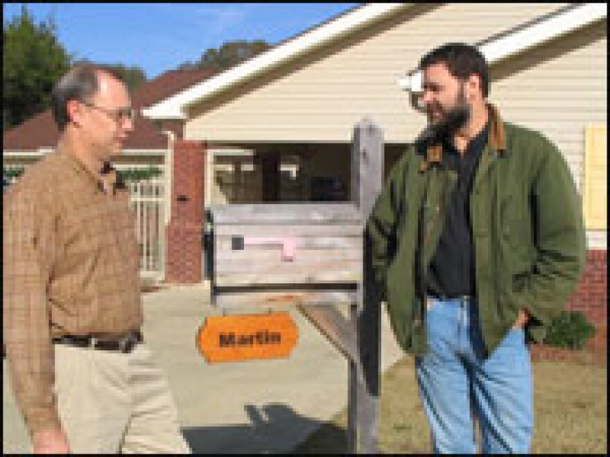 Bill Thomas, right, stands with Steve McAlilly of Mississippi Methodist Senior Services outside one of the new nursing homes built on the Green House Project model in Tupelo, Miss.