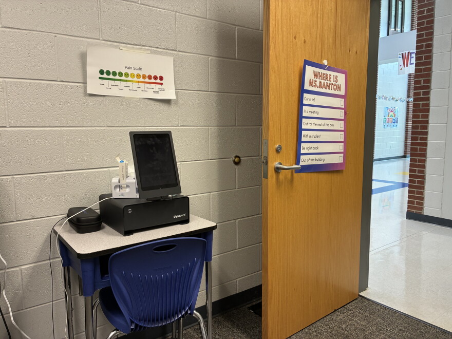 School office with desk and computer screen used for telehealth 