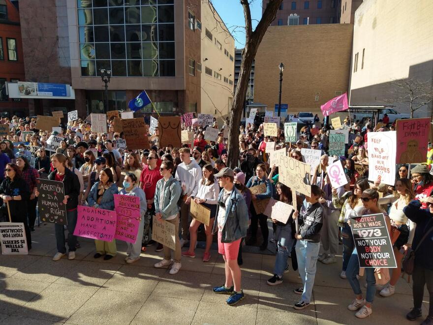 Abortion rights marchers gather at the end of the march to listen to speeches outside the Federal Courthouse in Milwaukee on Saturday afternoon.