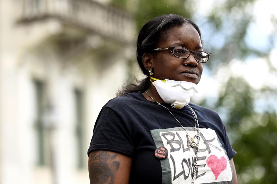 Holly Tucker, 37, of New Haven joined the Caravan 4 Justice rally at the Connecticut State Capitol in Hartford to demonstrate against the systemic abuse of police power perpetrated against the Black community.