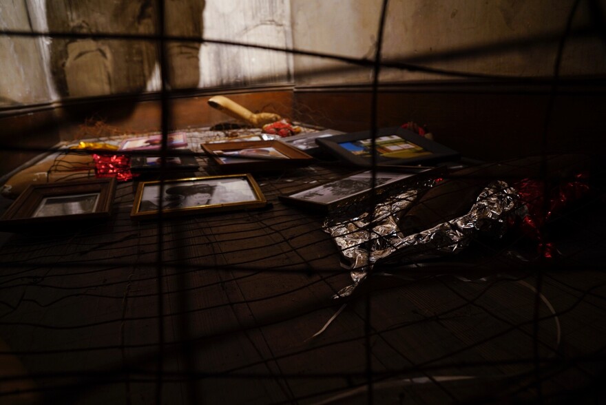 Photographer SHAN Wallace's experimental work delves into personal and public grief by creating a vigil within Greensboro's Elsewhere Museum.