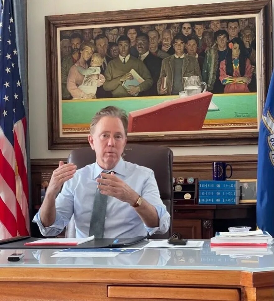 On the wall behind Gov. Ned Lamont is a Norman Rockwell original, “Right to Know.” His charitable contributions included money to the Rockwell museum in Sturbridge, Mass.