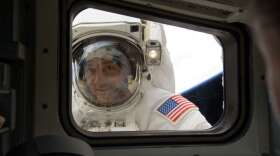 Astronaut Mike Massimino looks into the Space Shuttle while on a spacewalk to service the Hubble Space Telescope. Photo: NASA