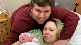 Annie Moore and Darren Gilio are pictured with their newborn, Delilah Rae Gilio.