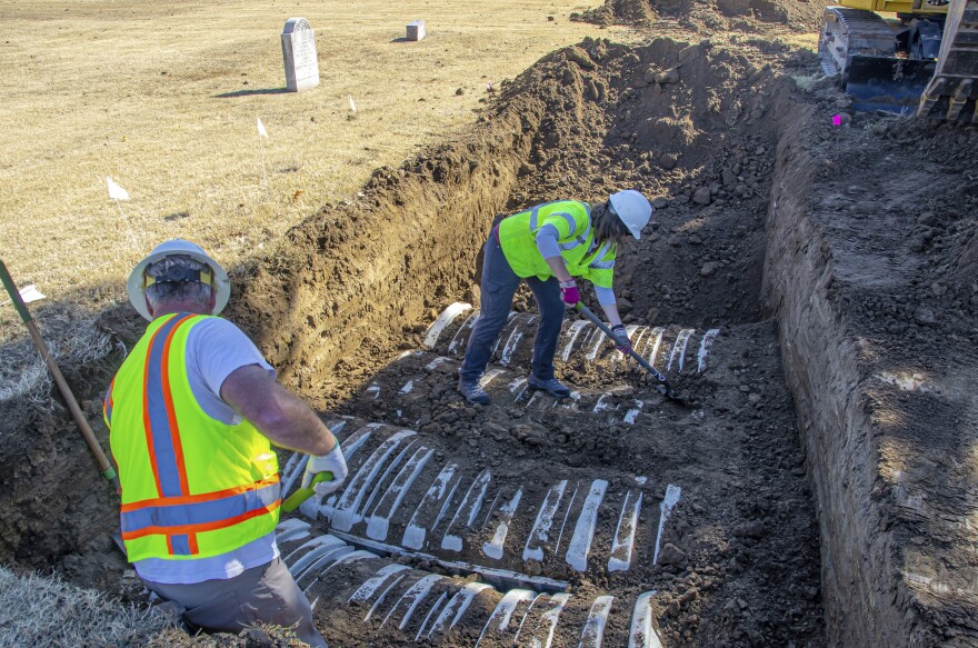 In this image provided by the city of Tulsa, Okla., crews work on an excavation at Oaklawn Cemetery searching for victims of the 1921 Tulsa Race Massacre on Oct. 26, 2022, in Tulsa. The latest search for remains of victims of the massacre ended Friday, Nov. 18, with 32 additional caskets discovered and eight sets of remains exhumed, according to the city.