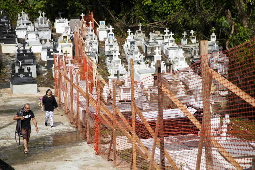 Before opening for Mother's Day, officials installed a plastic fence to keep people out the cemetery's most damaged areas. A landslide during Hurricane Maria destroyed nearly 1,800 tombs in the cemetery.