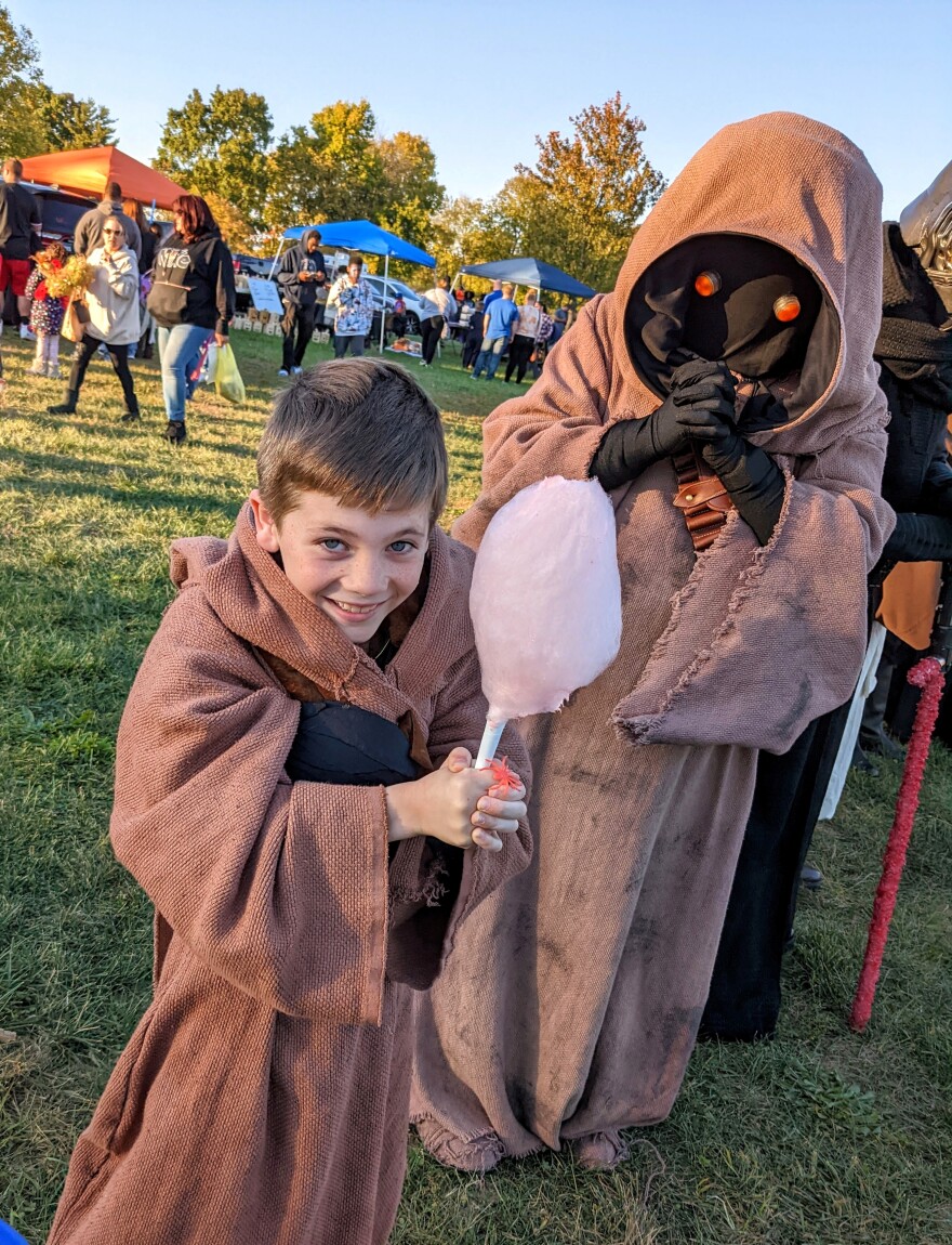 Hudson Lotz takes a break from being a Jawa to enjoy some cotton candy.