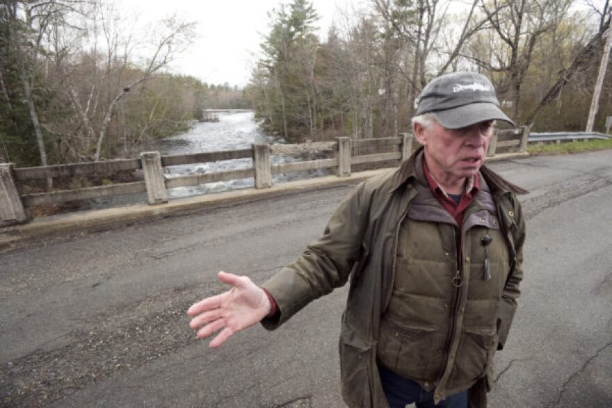 Dale Wheaton, former owner of Wheaton's Lodge in Forest City, Maine, on the bridge over the Forest City Stream at the border crossing between the United States and Canada. 