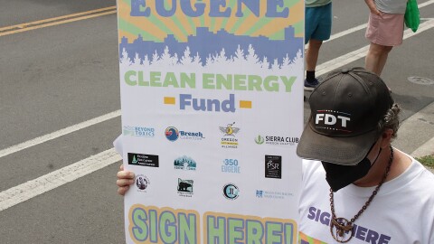 Eugene Clean Energy Fund supporters march through downtown Eugene, July 21, 2026.