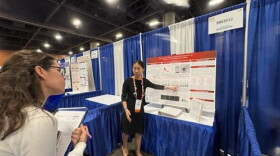 Lily Ma explains her research to judges at this year's Regeneron International Science and Engineering Fair in Phoenix, Arizona.
