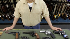 Mark Diaz, manager of Schrank's Smoke 'n Gun shop, displayed several handguns for sale at the store last year in Waukegan, Ill., north of Chicago. When the Supreme Court ruled Monday that most Americans can have a handgun in their homes for self-defense, it left Chicago officials scrambling to put together a new handgun law.