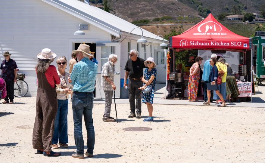 Guests chatting and enjoying the coastal sunshine during the KCBX Community Celebration