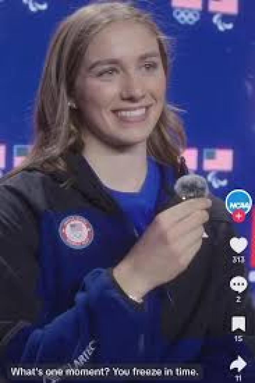 Caroline Harvey holding gold medal