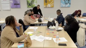 Attendees at a Queens Village Dayton co-design session work on a plan to support the health of local women and infants.