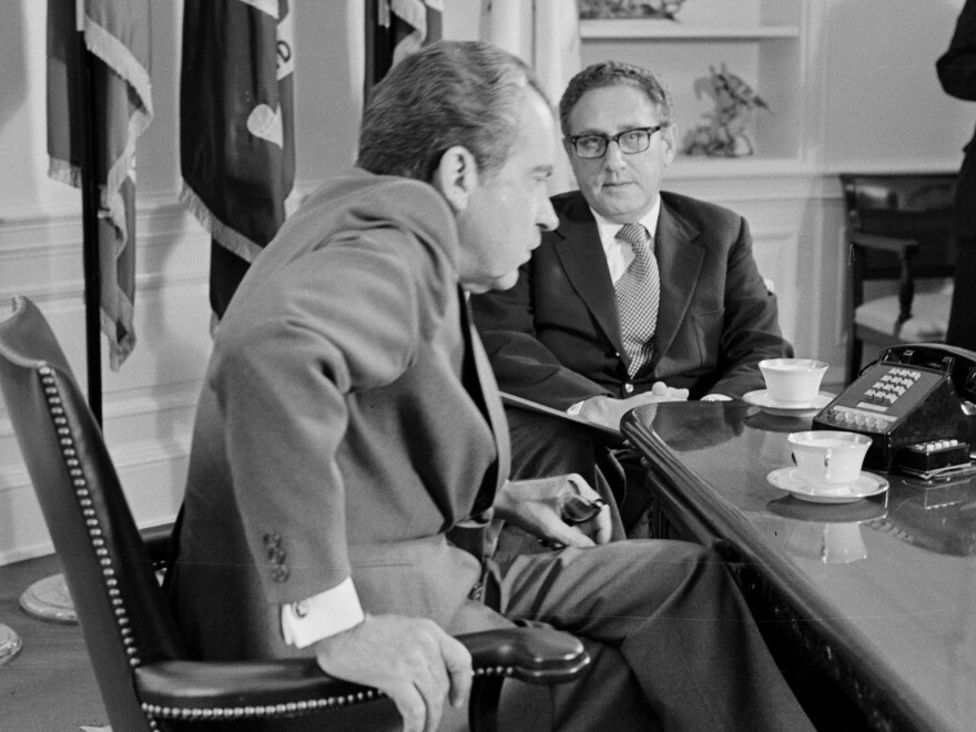President Nixon meets Secretary of State Henry Kissinger in the Oval Office of the White House on Oct. 9, 1973. Days before the 1972 election, Kissinger declared that peace was "at hand" in Vietnam.