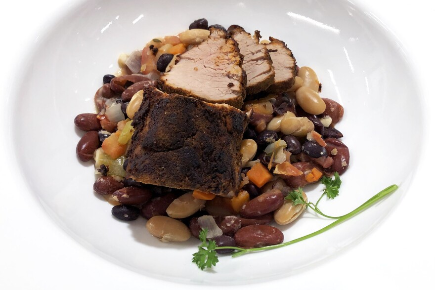 The pork is rubbed with a spice mixture, then seared and roasted in the same pan.