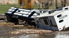 A flooded campground and damaged RVs.