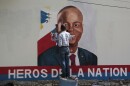 FILE - Artists paint a portrait of slain Haitian President Jovenel Moise near the presidencial residence where he was assassinated two years ago in the Petion-ville area of Port-au-Prince, Haiti, July 7, 2023.