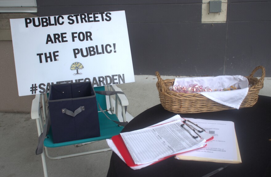 Save the Garden volunteers set up shop outside East Community Library in Clearwater last Saturday afternoon. They said Friday morning's near-torrential downpours didn't stop 35 residents from signing their petitions in the first hour.