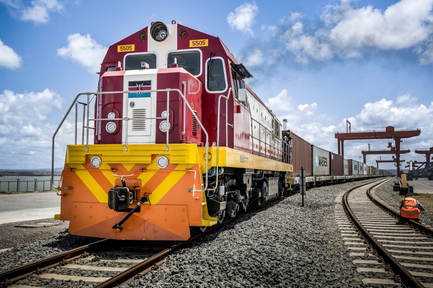 China's New Silk Road project is lending out billions to countries in Central Asia, the Middle East and Africa to build and upgrade railways, ports, pipelines, power grids and highways. Above: A Kenya Railways train pulls shipping containers as it departs from the Mombasa port station.