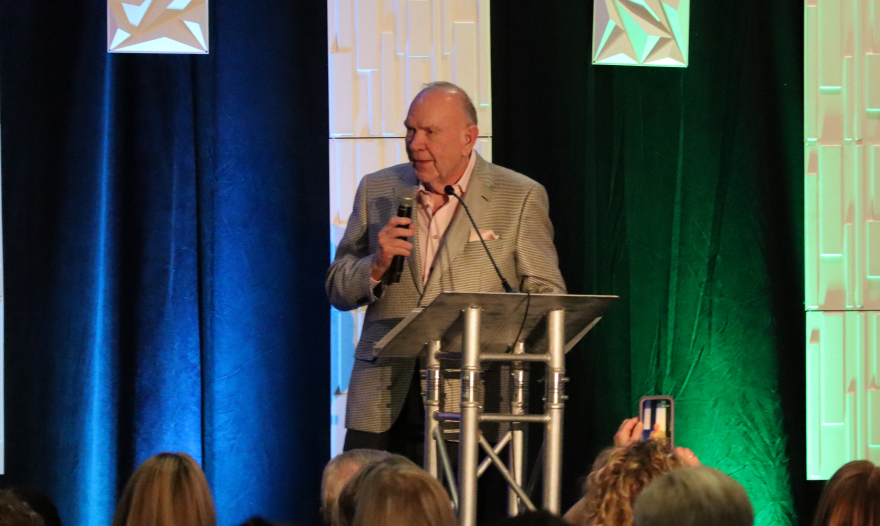 Brian Obie speaks to the crowd assembled at The Graduate.