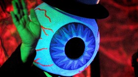 A member of The Residents waves to the crowd after a performance in Moscow on  September 8, 2001.