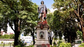 FILE - A vandalized statue of Christopher Columbus towers over Columbus Square in Port of Spain, Trinidad and Tobago, on Aug. 28, 2024.